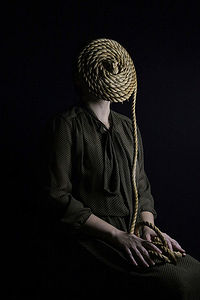 Self-portrait. Rope symbolize maze of thoughts and feeling.